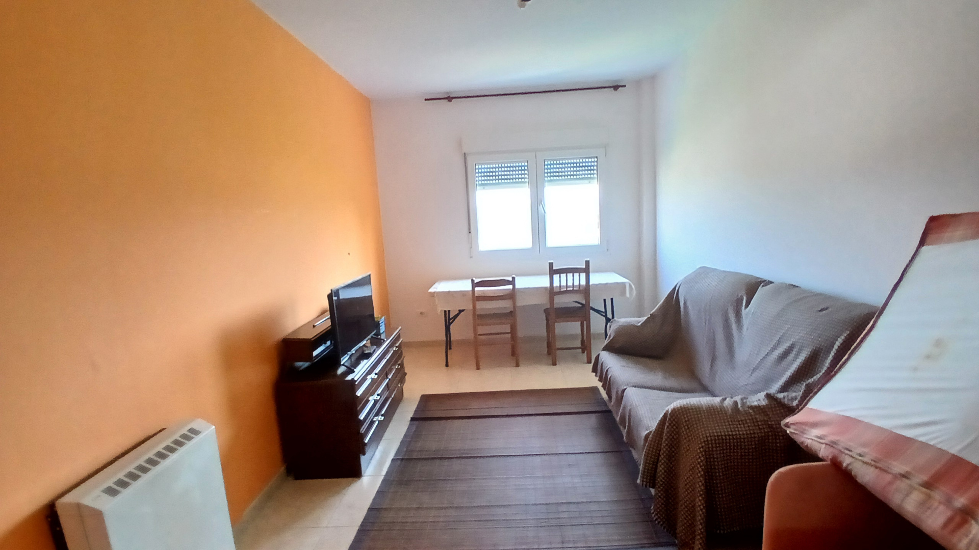 Furnished one-bed apartment lounge